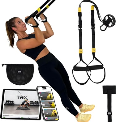 A woman using a TRX suspension trainer kit with a door anchor and mobile workout app for home fitness.