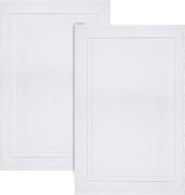 Set of two white plush cotton bath mats with a decorative rectangular border for bathroom floor decor.