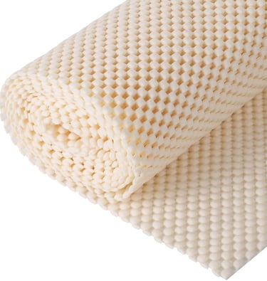 a close up of a mattress with a blanket on top