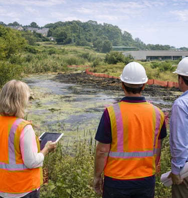cobb county landscape with customer evaluating retention pond