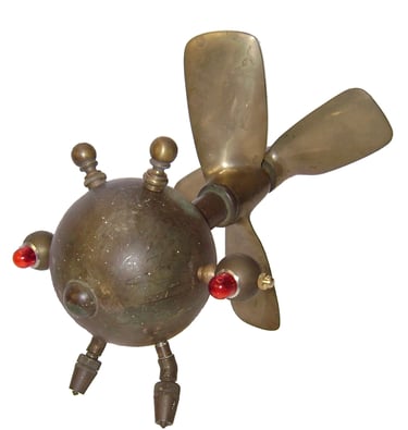 Flying brass bug creature by assemblage artist Tal Avitzur.