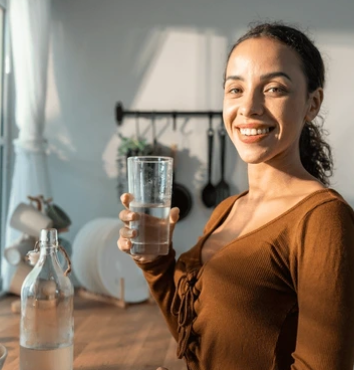 woman hydrating with water