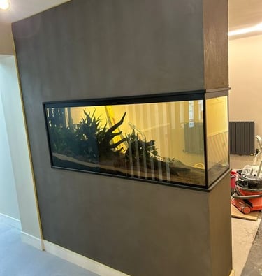 a fish tank with a fish tank in the middle of a room