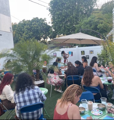 Guests enjoying a Sip & Paint event on the patio at Kava Bar LA & Botanical Lounge