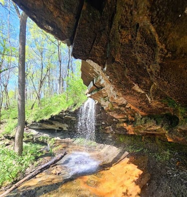 Huntsville, AL - View of Carter's Chalybeate waterfall from under the rock cliff in Monte Sano Park