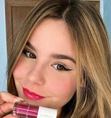 a woman with long hair and a pink lipstick