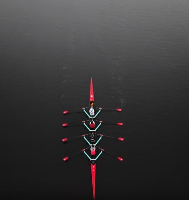 a group of people rowing a boat in unison in the water