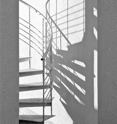 a spiral staircase with guardrails