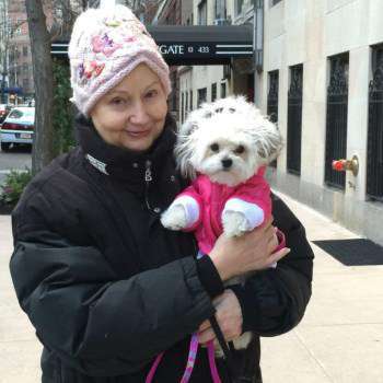 happy puppy mom carrying her new puppy