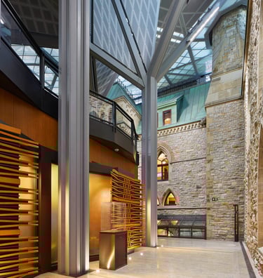 a large gallery with a stone walls and floors