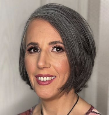 A headshot of Andrea Czabo Csilla