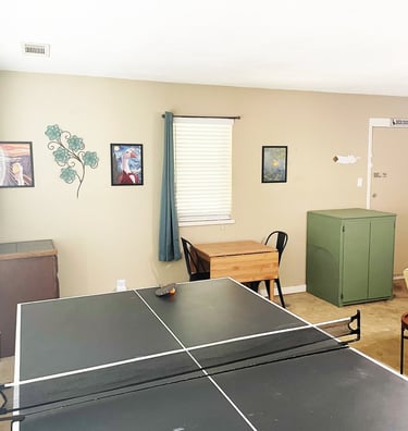 a ping pong table in game room