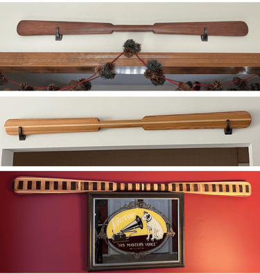 Decorative wooden paddle on display