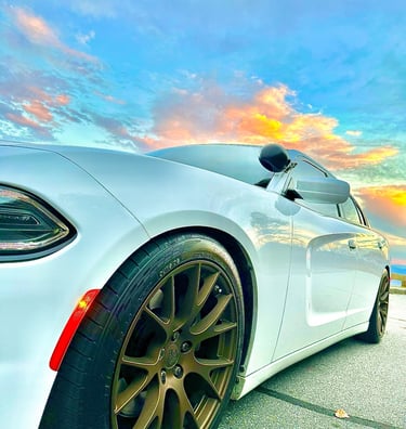 White Dodge Charger with copper chrome rims parked on the Blue Ridge Parkway for auto locksmith services
