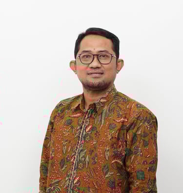 a man in a floral shirt and glasses