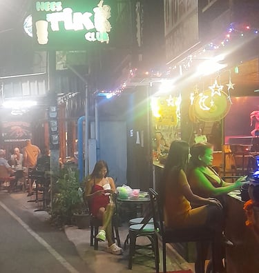 Thai women sat outside Nees Tiki Club on Petchkasem Road in Hua Hin