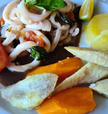 a plate of food with a variety of vegetables madagascar