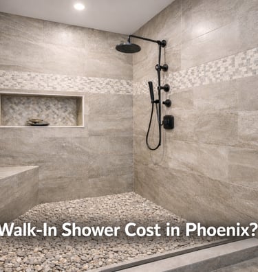 Modern walk-in shower with natural stone tile, pebble flooring, and matte black fixtures for a luxury bathroom remodel.