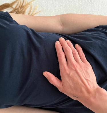 a woman with her hands on her stomach