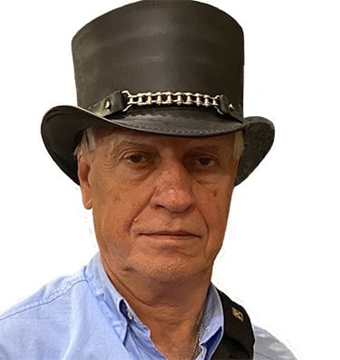 Photo of author Dan Dooley wearing a Steampunk style top hat.