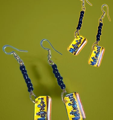 dangle earrings with hand drawn charms of Metrocards with black beads