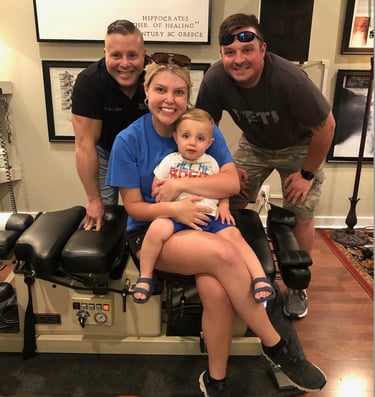 Dr. Scott Albano with a happy family after a chiropractic session
