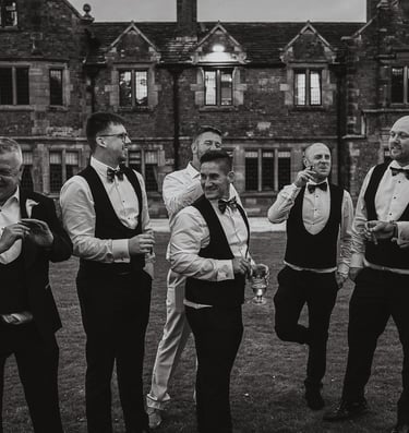 Wedding party celebrating together in Leeds – wedding photography and film by The Wedding Edit