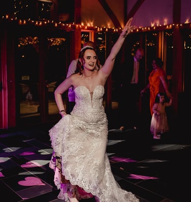 Friends cheering during wedding celebration in Leeds – natural wedding photography by The Wedding Ed