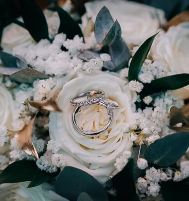 Wedding dress hanging in window light in Yorkshire – luxury wedding photography by The Wedding Edit