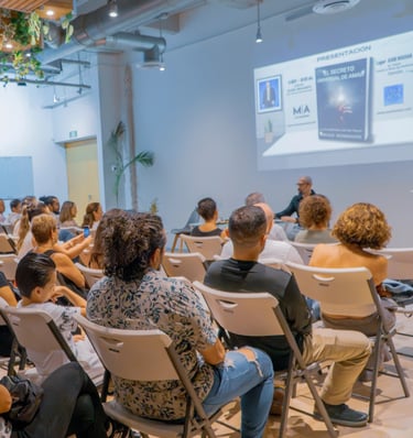 a man in a suit and tie is giving a presentation