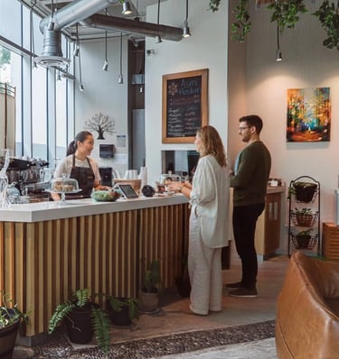 a woman standing in front of a counter top