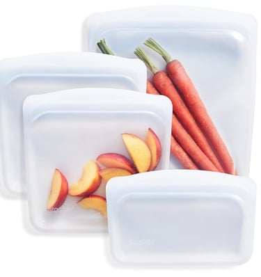Stasher 4-pack clear reusable platinum silicone food storage bags with Pinch-Loc seal.