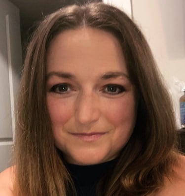 a woman with a blue dress and a black top