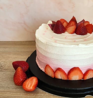 a cake with strawberries and strawberries on a table