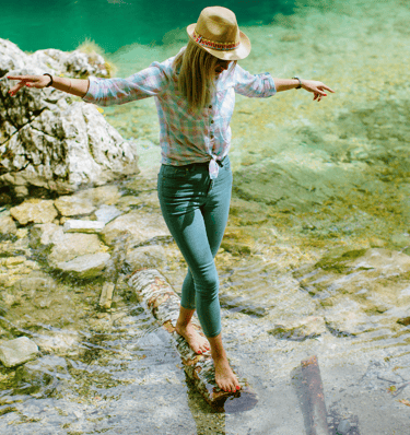 a women learning how to find balance in life and break free from people pleasing, as she is walking