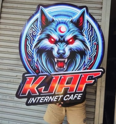 Sintra board sign with a glowing wolf head logo and 'KJAF Internet Cafe' text.
