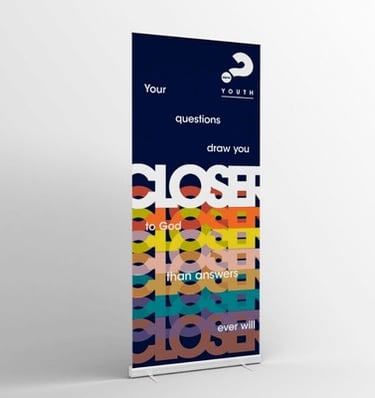 Youth event pull-up banner with the text 'Your questions draw you closer to God.