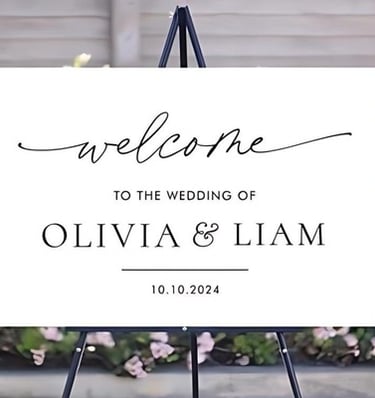Welcome sign for the wedding of Olivia and Liam on a white Sintra board.