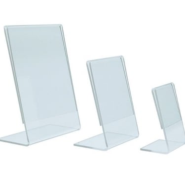 Set of three clear acrylic L type display toppers in varying sizes.