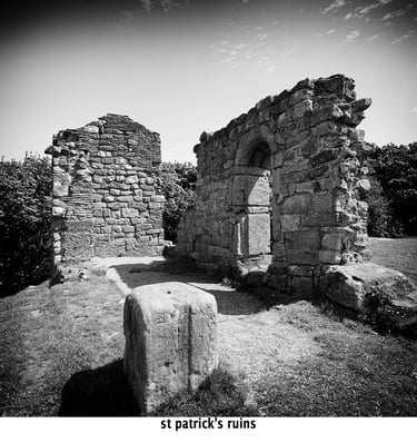 st patrick's ruins a stone wall with a stone arch at heysham