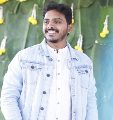 a man in a denim jacket and white shirt