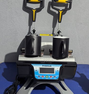 two magic mugs siting on a mug press