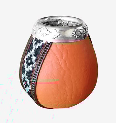 Handcrafted leather yerba mate gourd with silver rim and traditional fabric trim.