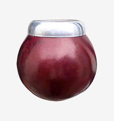 Deep red calabash mate gourd with a polished silver rim used for traditional yerba mate tea.