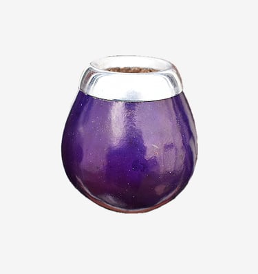 Polished purple gourd mate cup with a decorative silver metal rim for yerba mate tea.