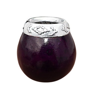 Handcrafted purple yerba mate gourd with a decorative silver rim and traditional patterns.