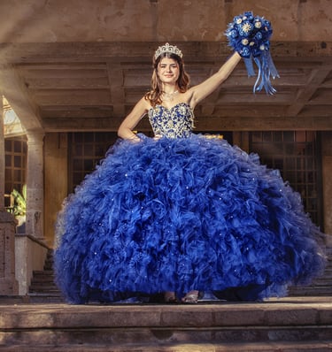 a woman in a blue dress with a bouquet in her hand