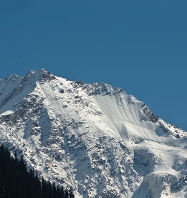 A snow covered mountain-peak.