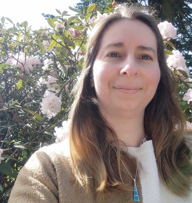 photo of author in front of flowering tree