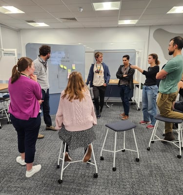 Workshop with participants brainstorming using sticky notes
